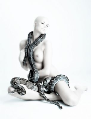 Nude girl with more snakes..